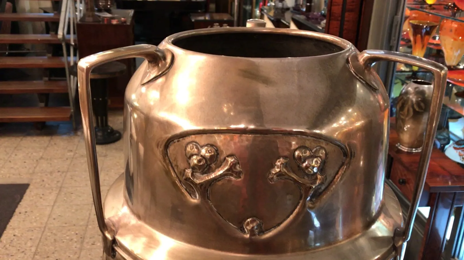 antique umbrella stand with decorative details at the front