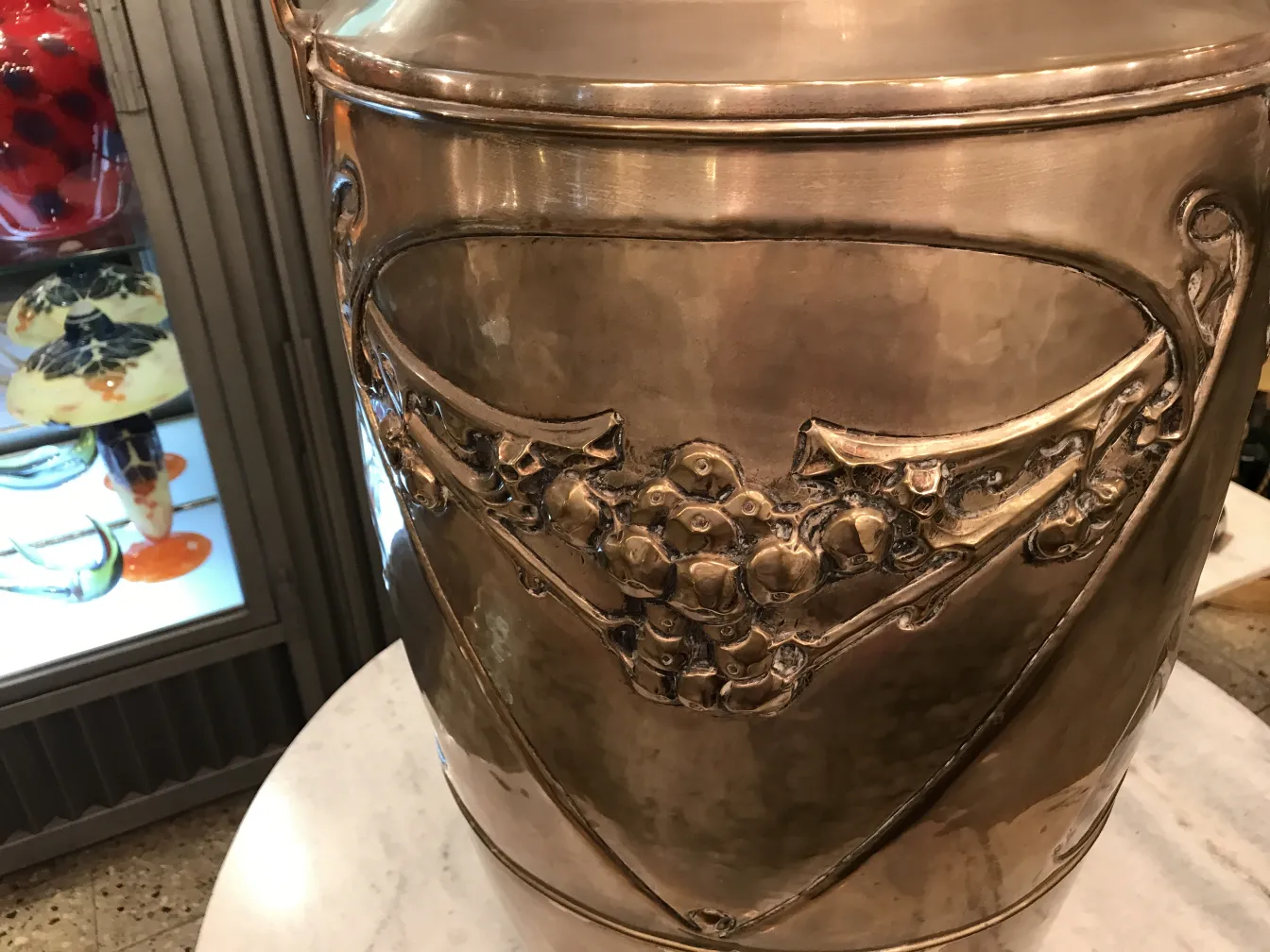 antique umbrella stand with decorative details in a setting