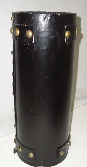 old black umbrella stand with golden metal embellishments