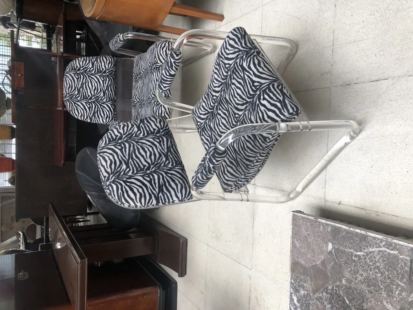 Two antique armchairs featuring a zebra design in a stylish setting