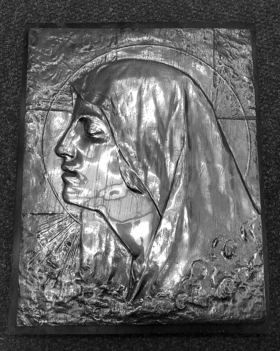 antique wall plate with relief figure