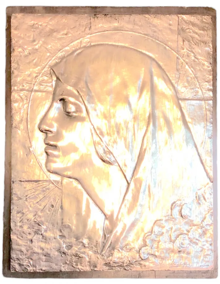 antique wall plate with religious relief, woman's face