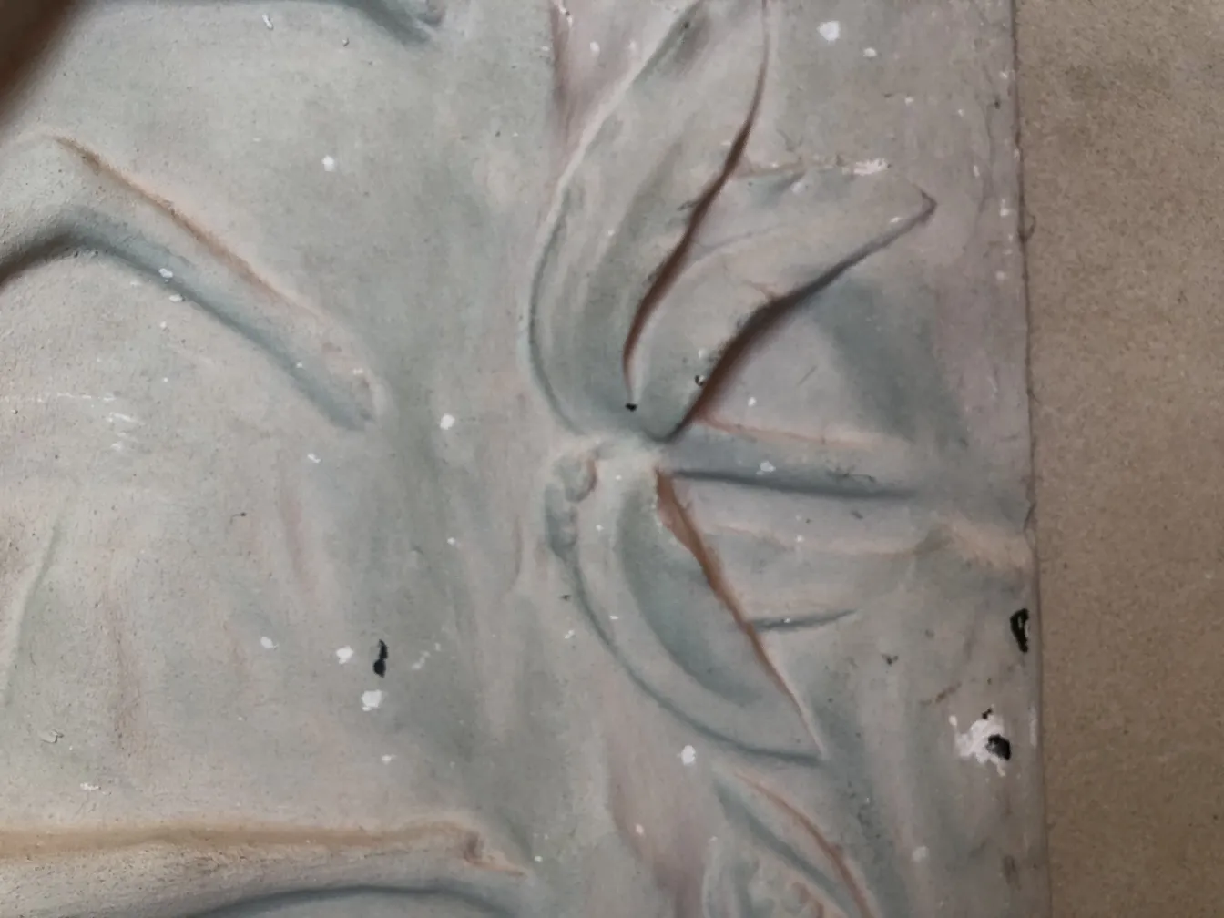 Antique wall plate with leaf relief and floral designs