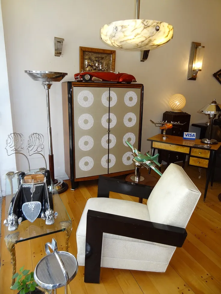 Decorative antique wall plate in elegant room with various furniture.