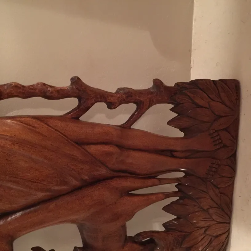 antique wall plate with carved natural figures, decorative