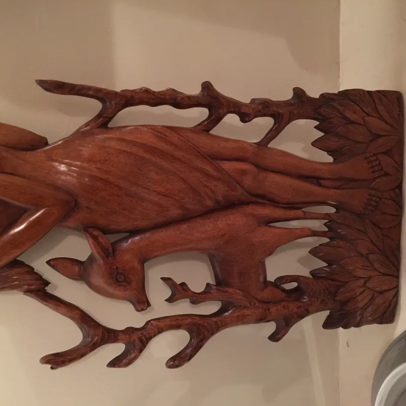 Antique wall plate decorative art featuring deer figures