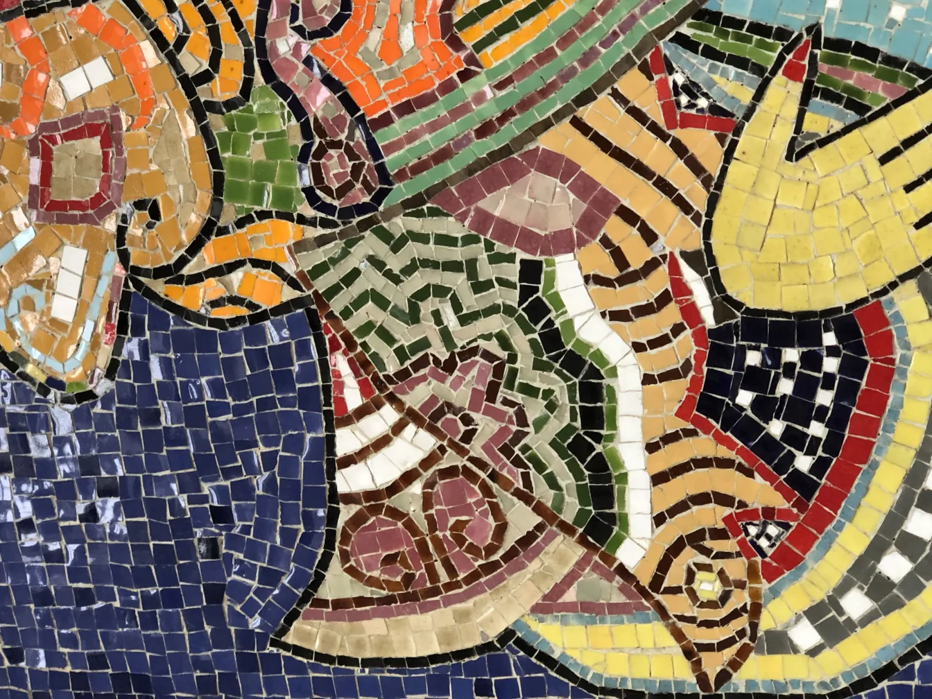 Antique mosaic panel featuring vibrant colors and intricate patterns.