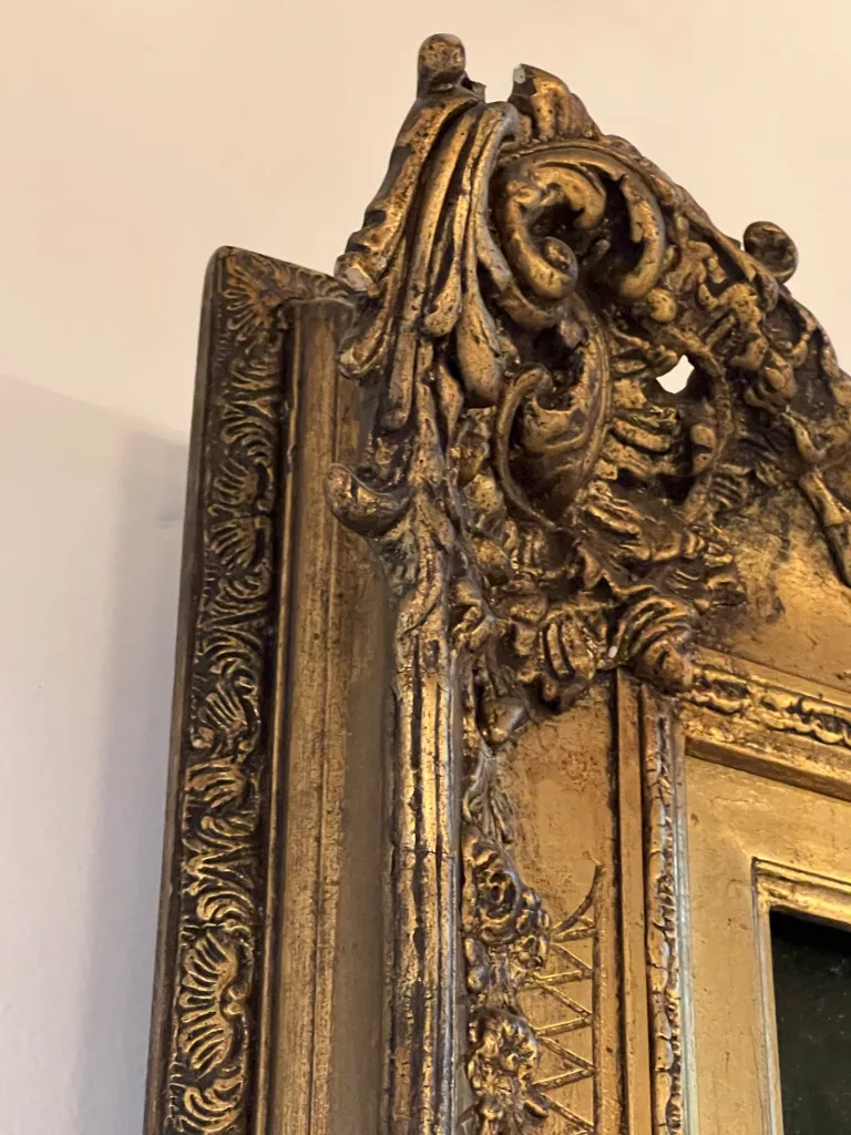 detailed view of an ornate gold decorative frame