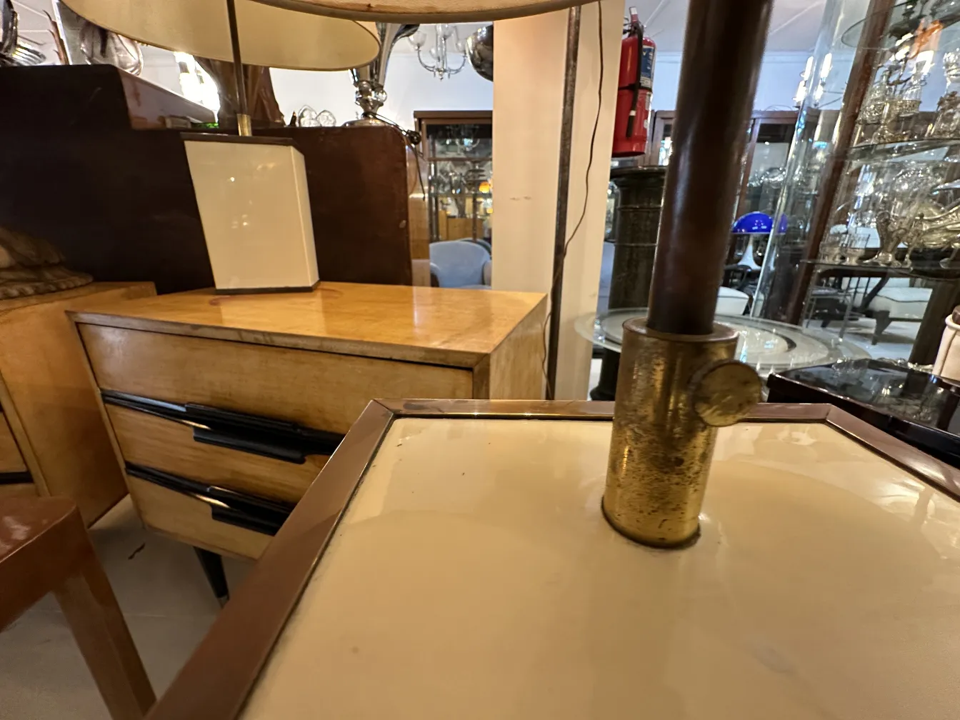 two antique table lamps on a table in a vintage setting