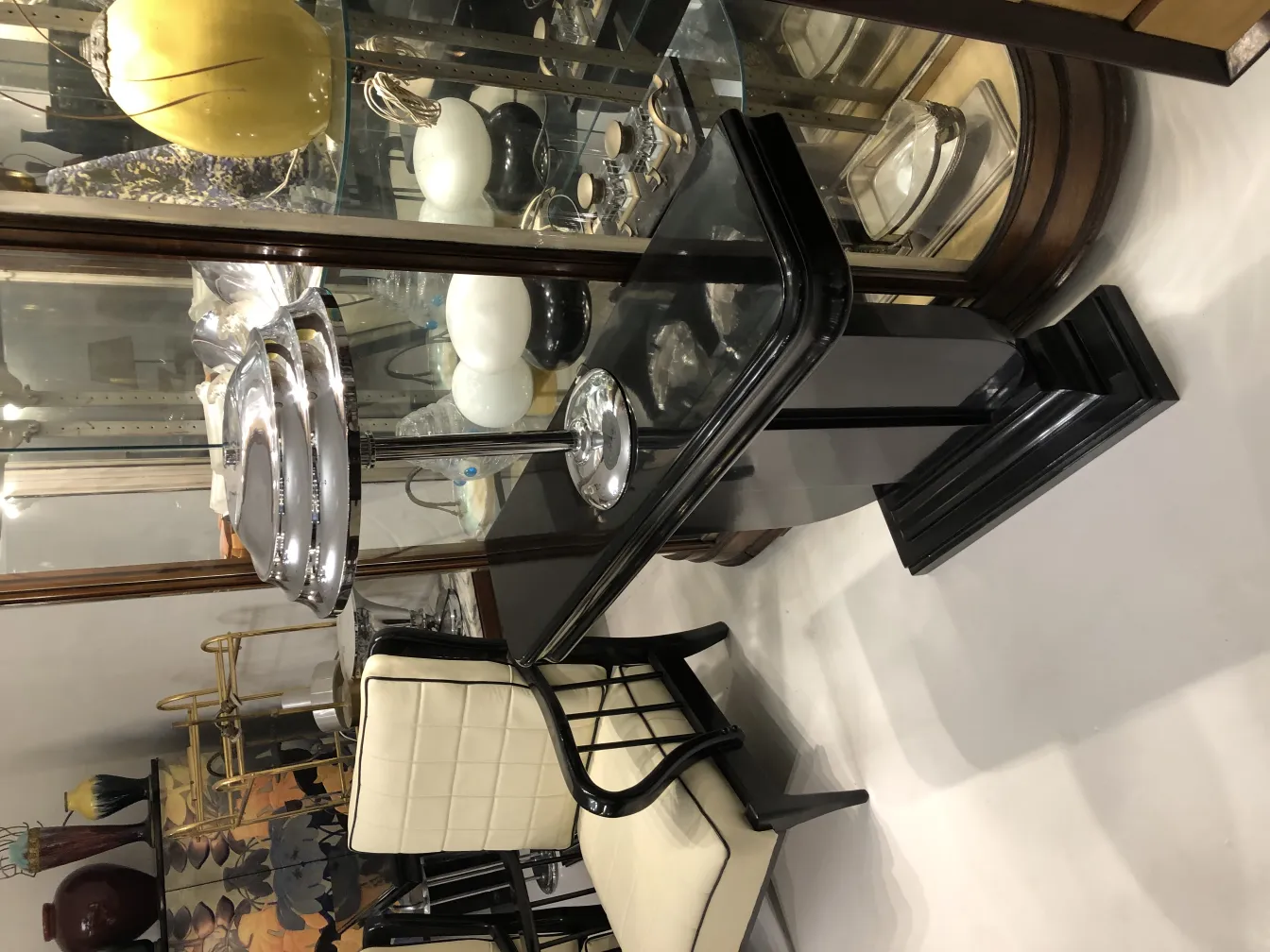 2 antique table lamps with elegant design and chrome base, in a classic setting.