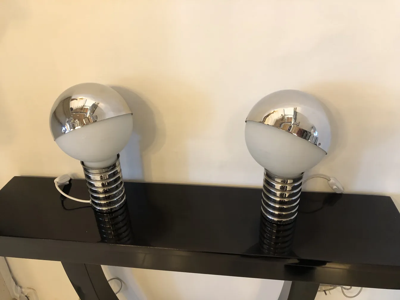 two antique table lamps featuring a modern spherical design