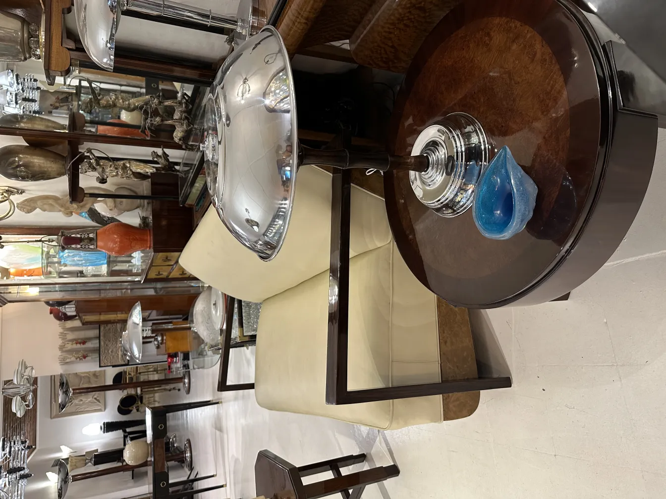 Two antique table lamps, elegant and decorative, near a sofa.