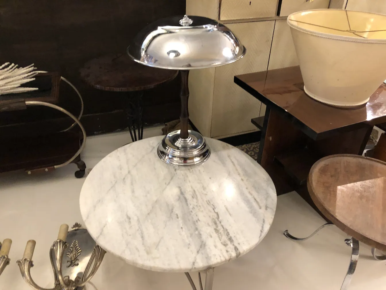 two table lamps with metal base and elegant design in an antique setting
