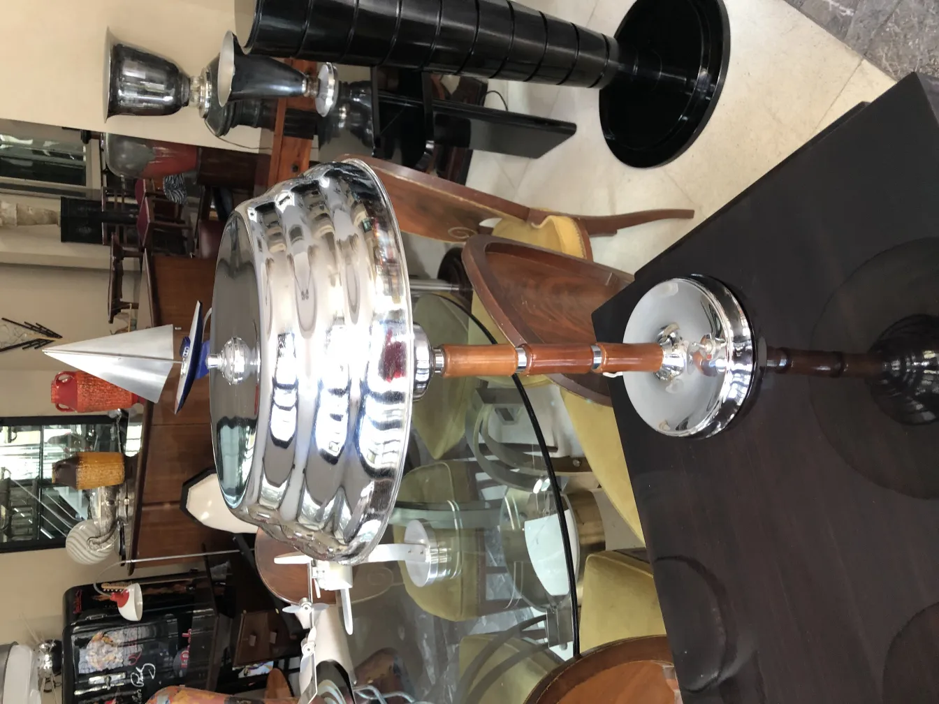 Two antique table lamps with an elegant design, surrounded by vintage furniture