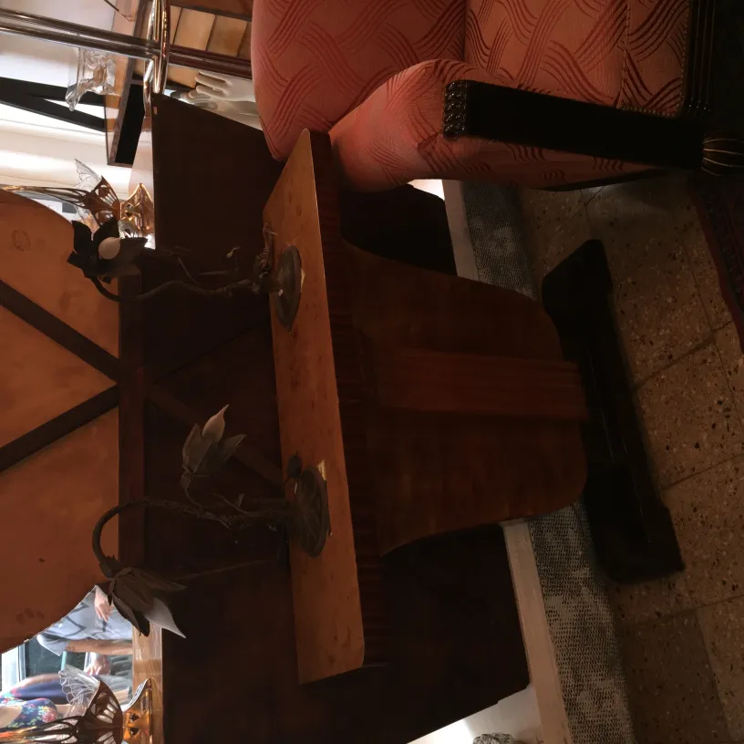 Two antique table lamps with decorative design on a table