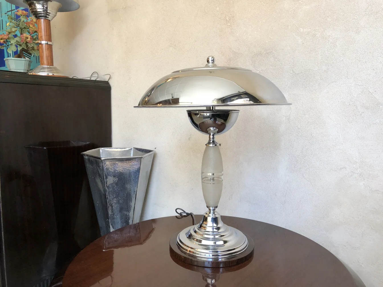 two antique table lamps with shiny finishes