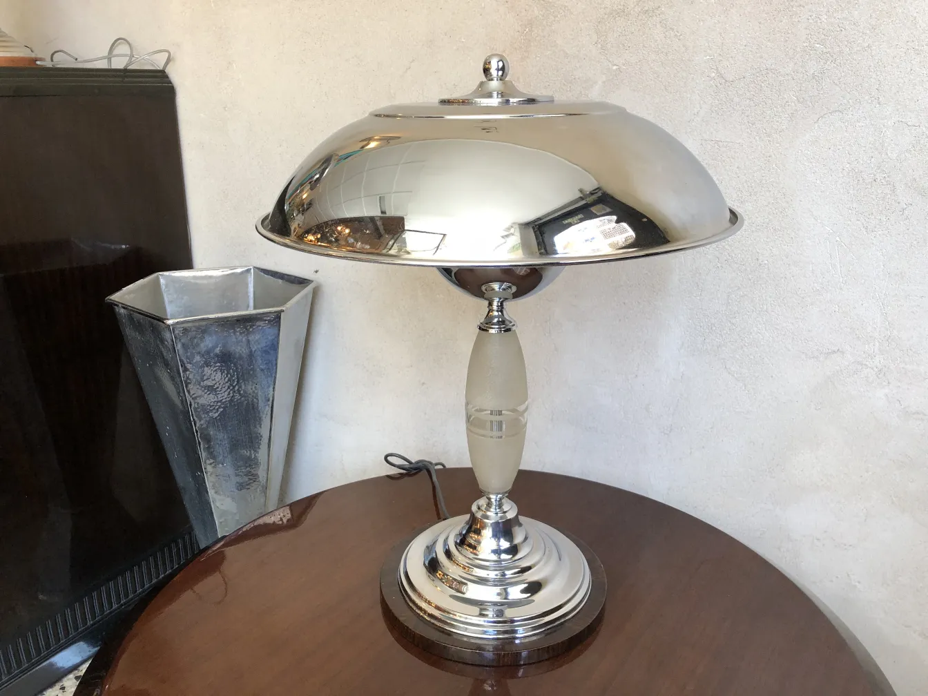Two antique table lamps with dome design in an elegant setting.
