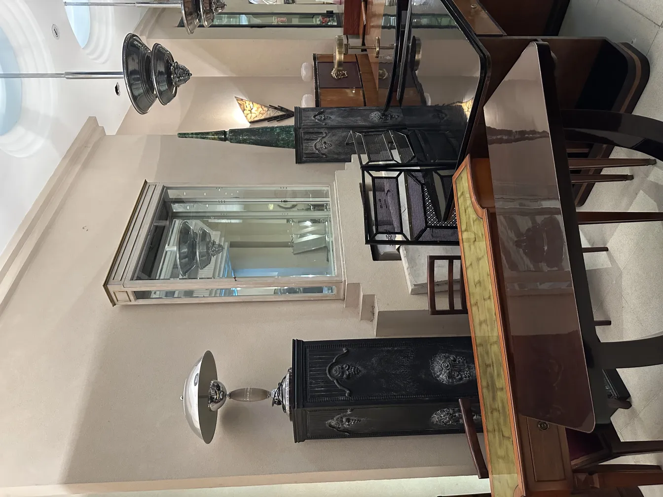 two antique table lamps in an elegant setting with furniture