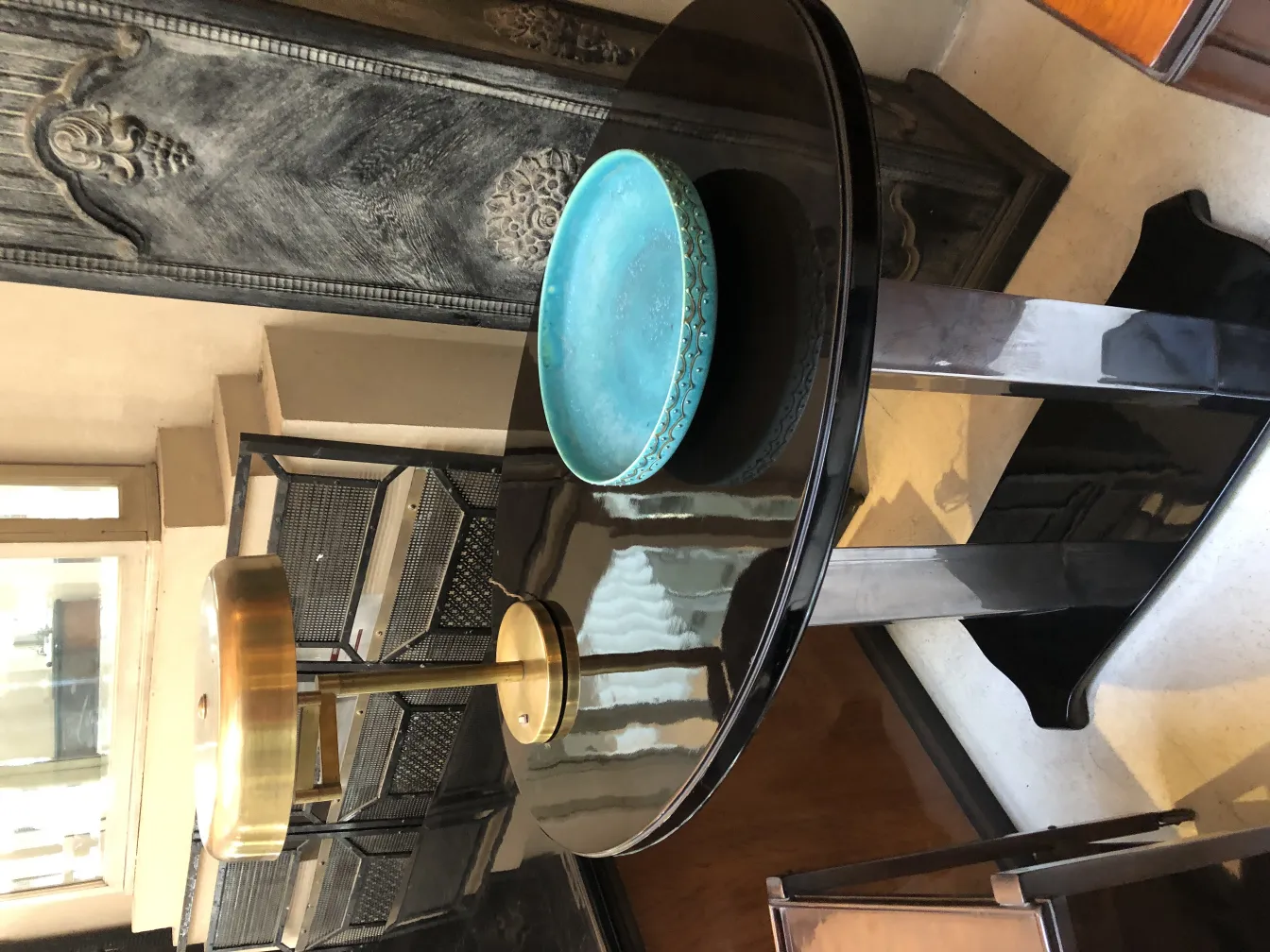 View of two decorative antique table lamps on a black table