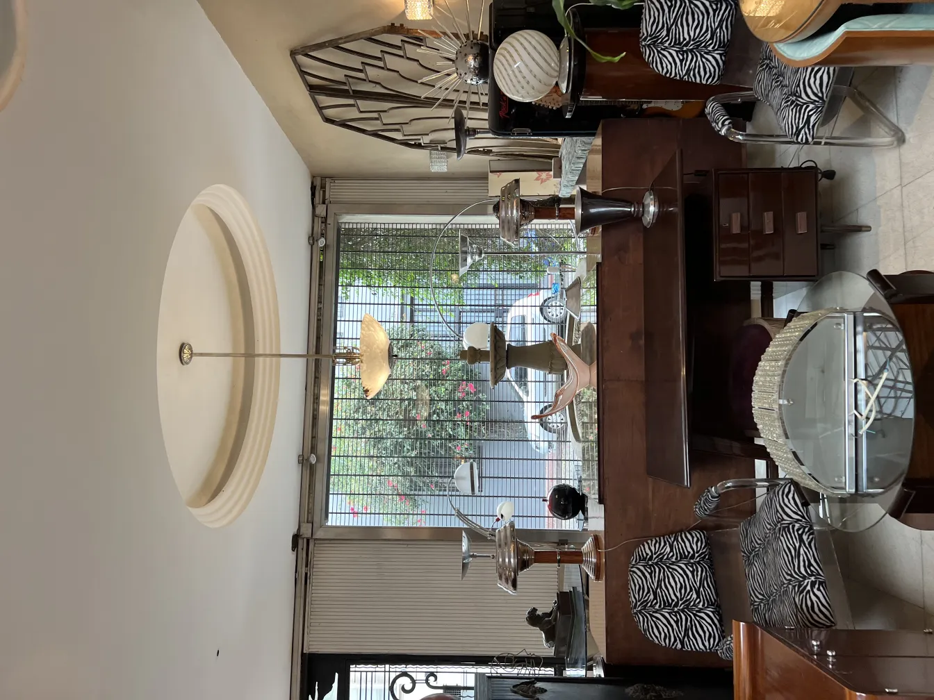 two antique table lamps in an elegant setting with a varied background