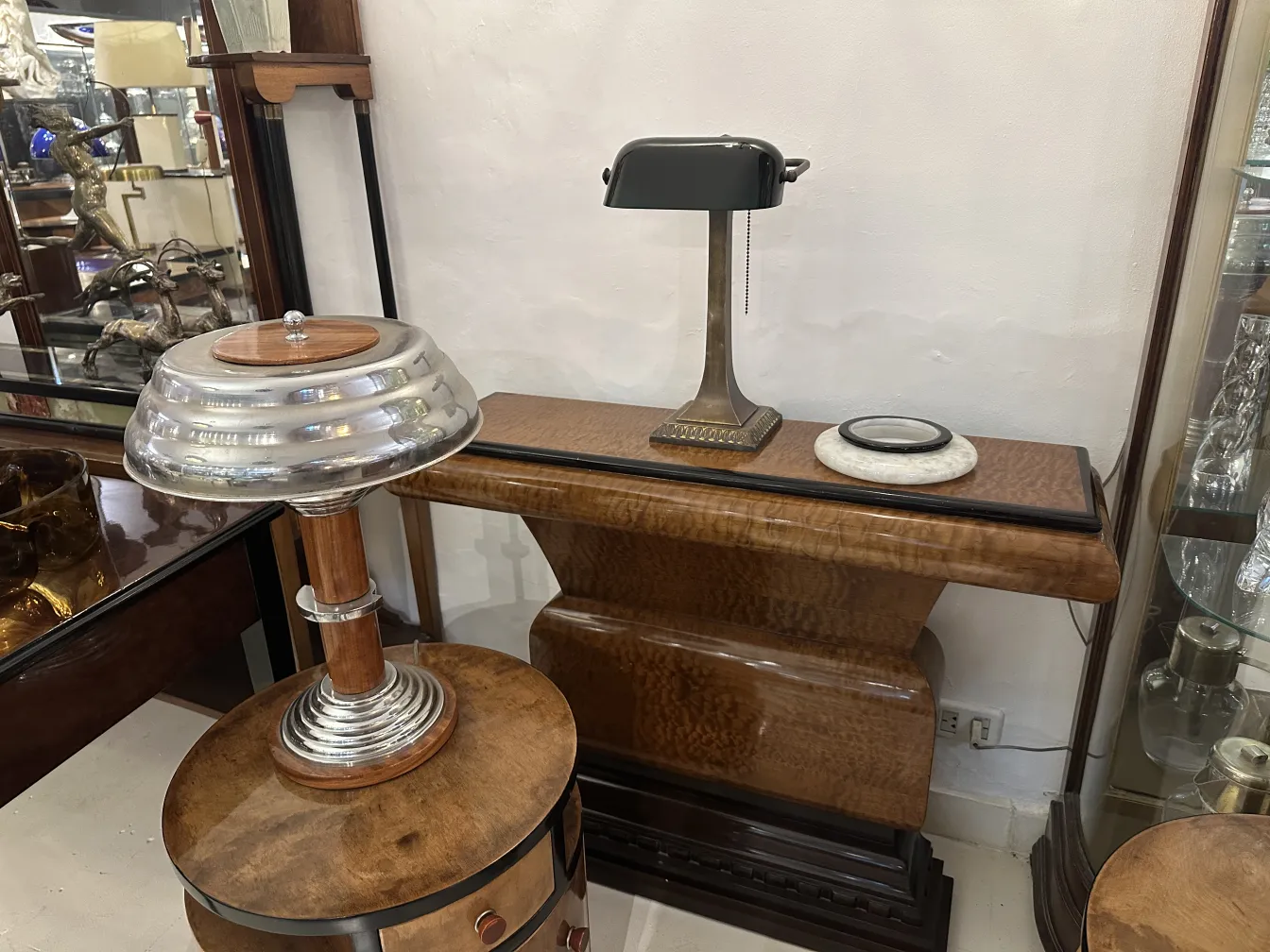 Two antique table lamps with elegant design in a decorative setting.