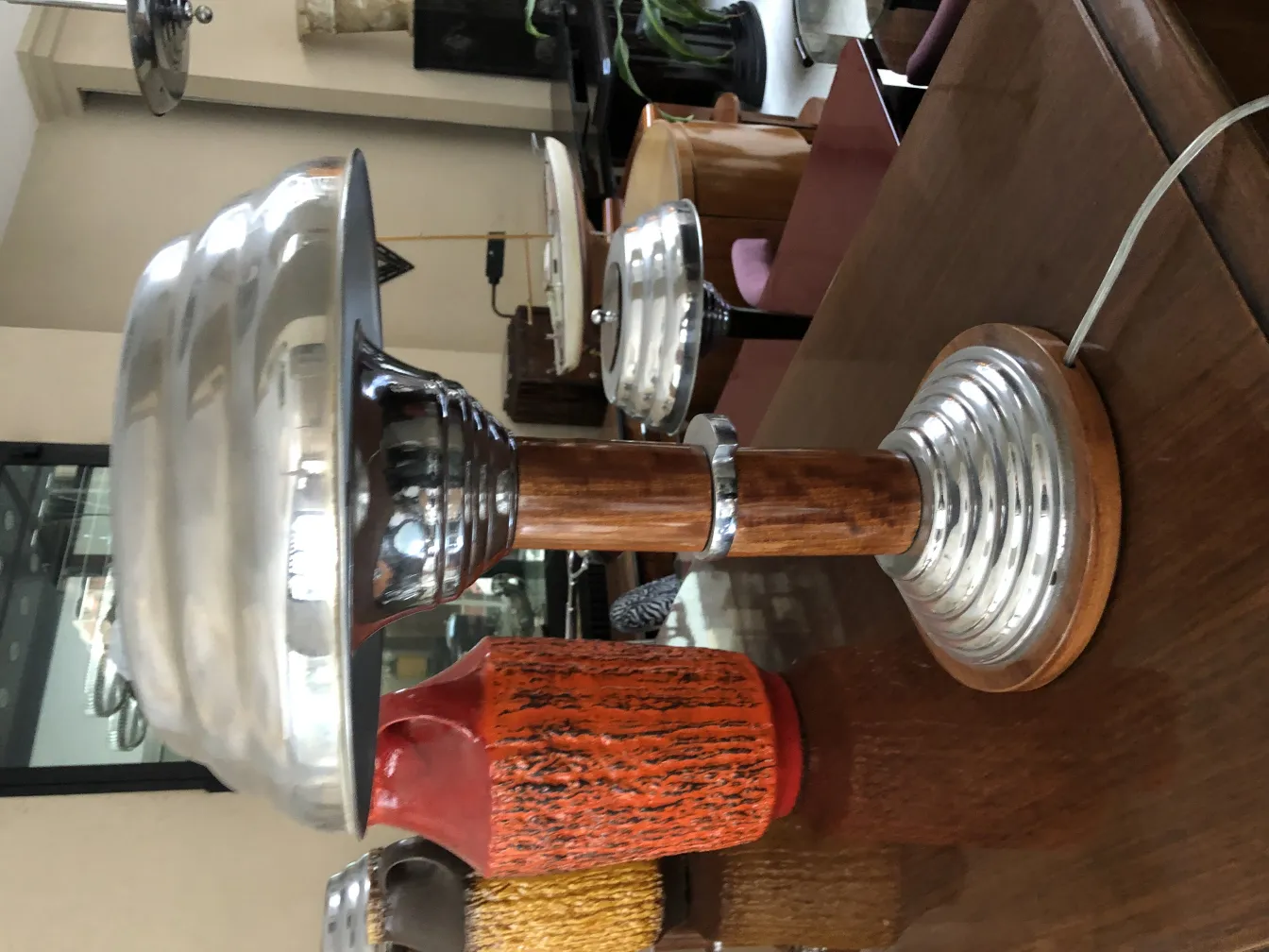 Two antique table lamps with decorative bases and shiny shades, cozy atmosphere