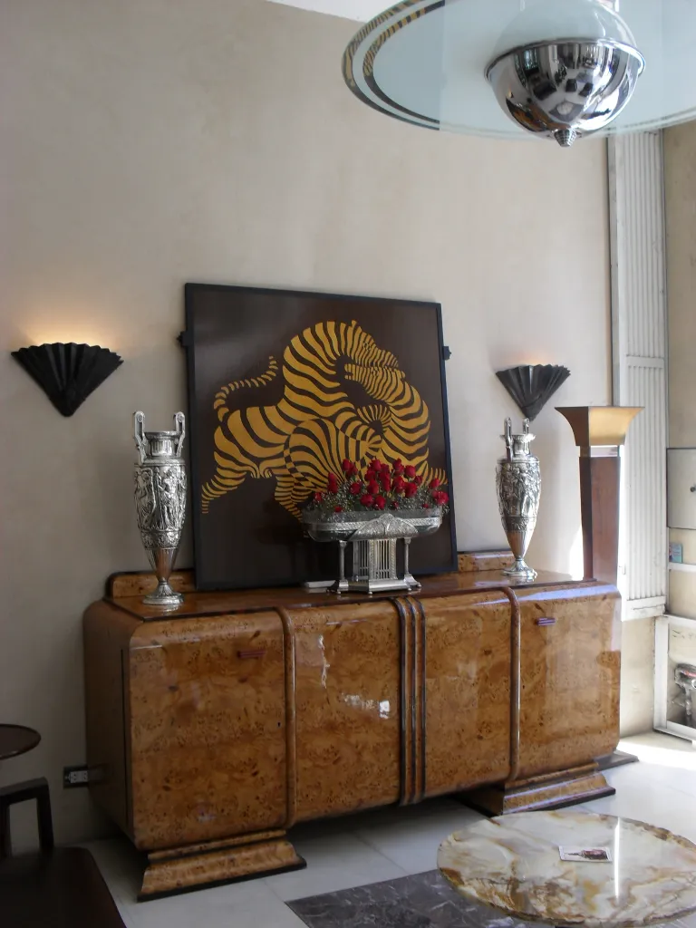 two antique table lamps in an elegant setting with decor