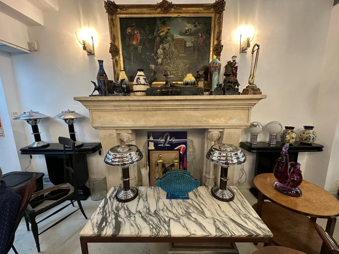 Two antique table lamps in a decorative setting