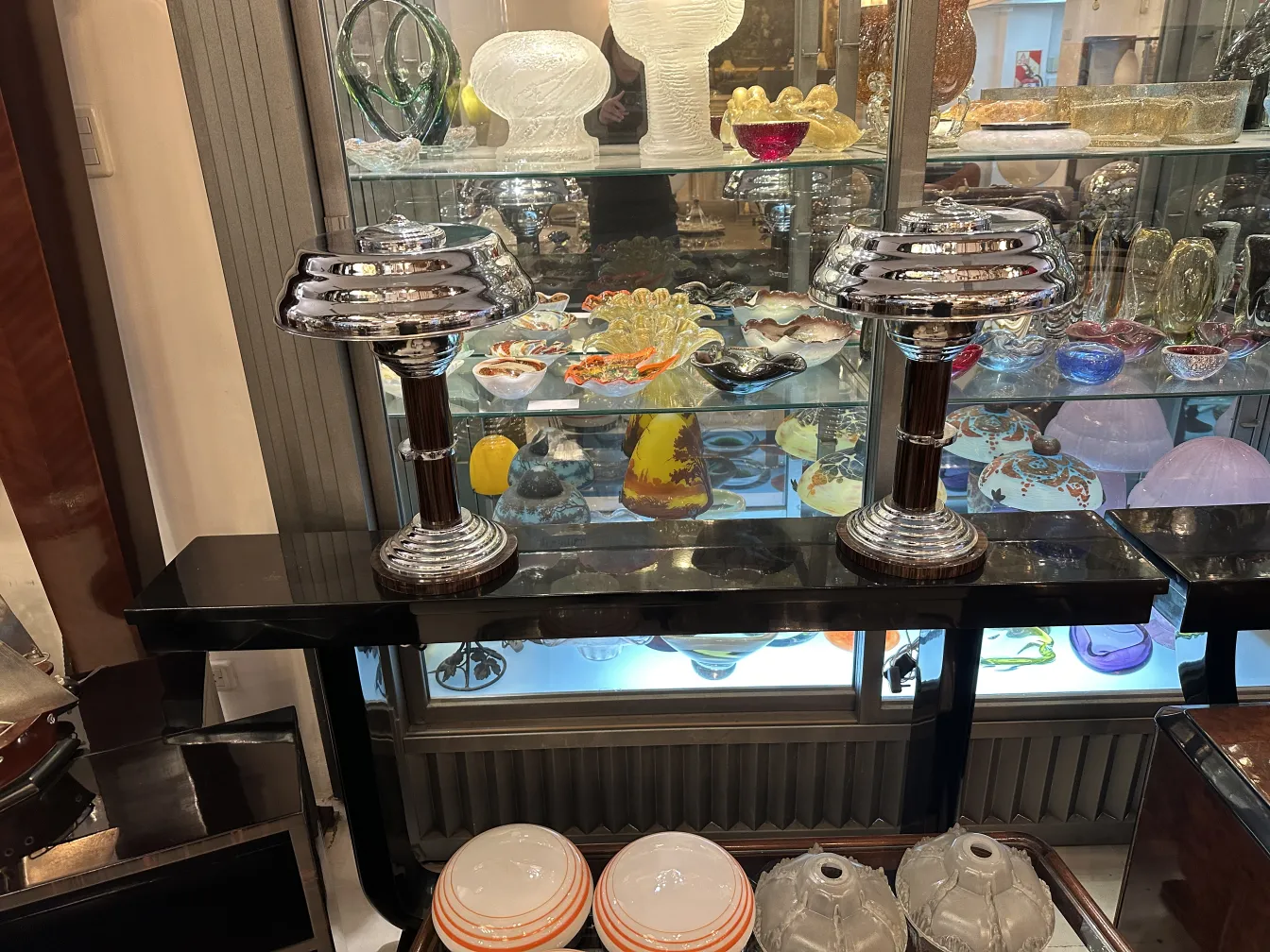 two antique table lamps with classic design bases, set in an elegant environment