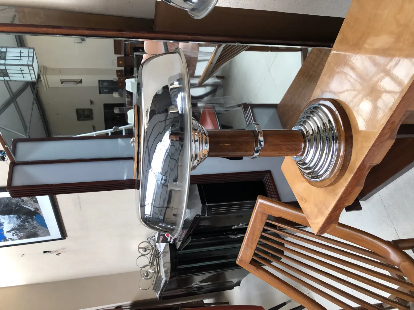 two antique table lamps with shiny base, set in an elegant environment.