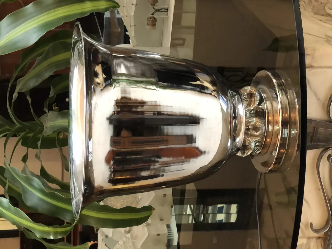 2 antique table lamps with a special shine on a table.