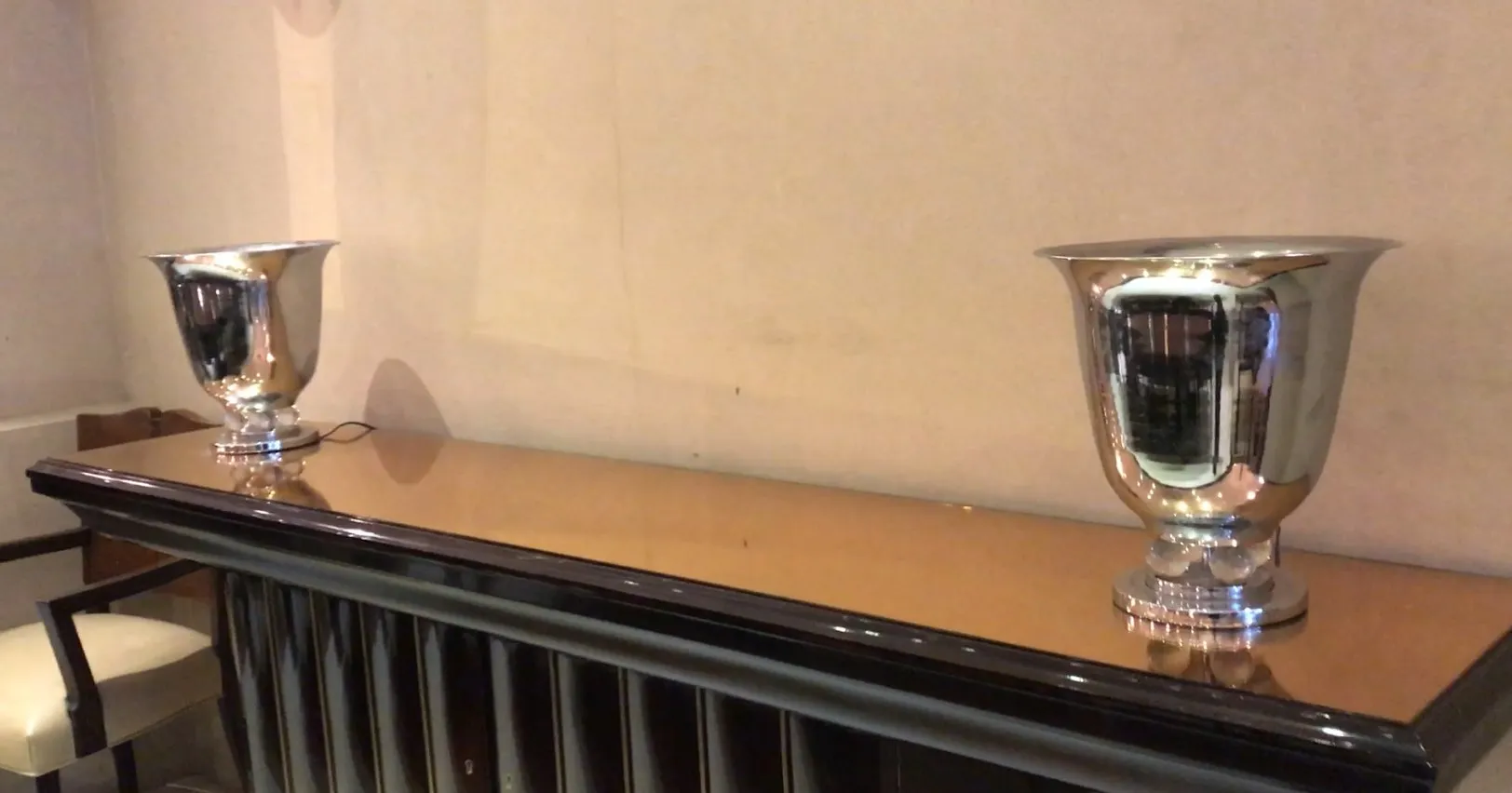 two shiny antique table lamps on a table