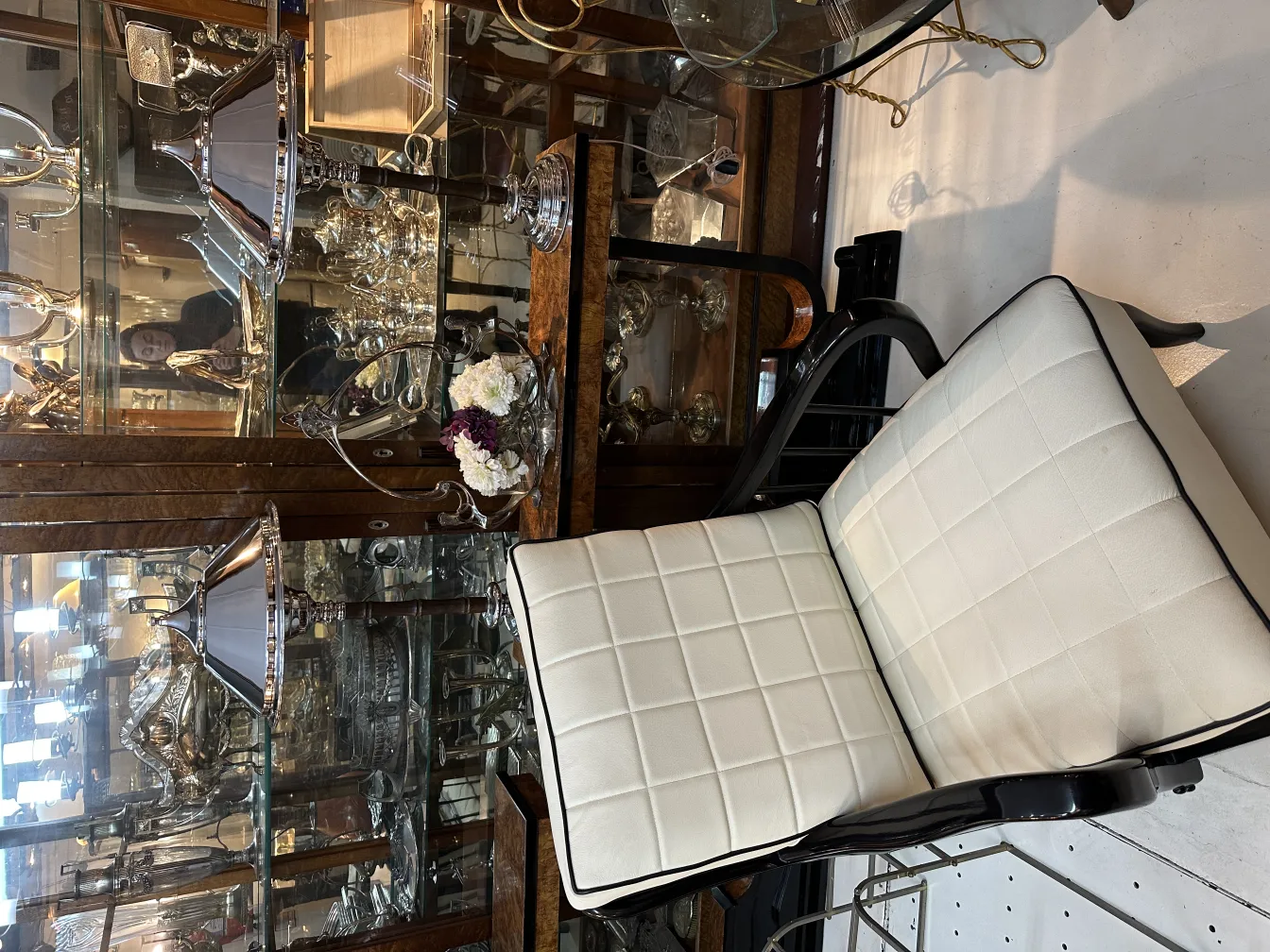 Two antique table lamps with unique details in an elegant setting, surrounded by decorative objects