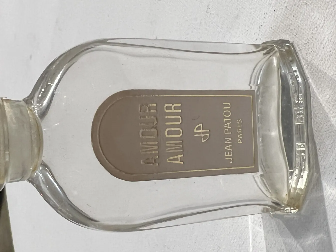 antique perfume bottle with love label, clear design