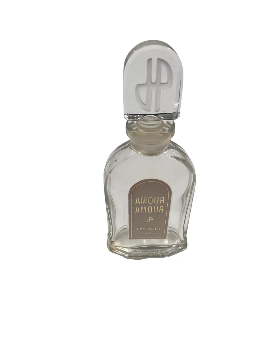 flacon de parfum ancien avec design classique et bouchon unique