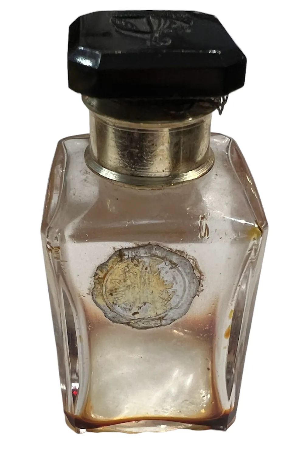 antique perfume bottle with octagonal cap and label