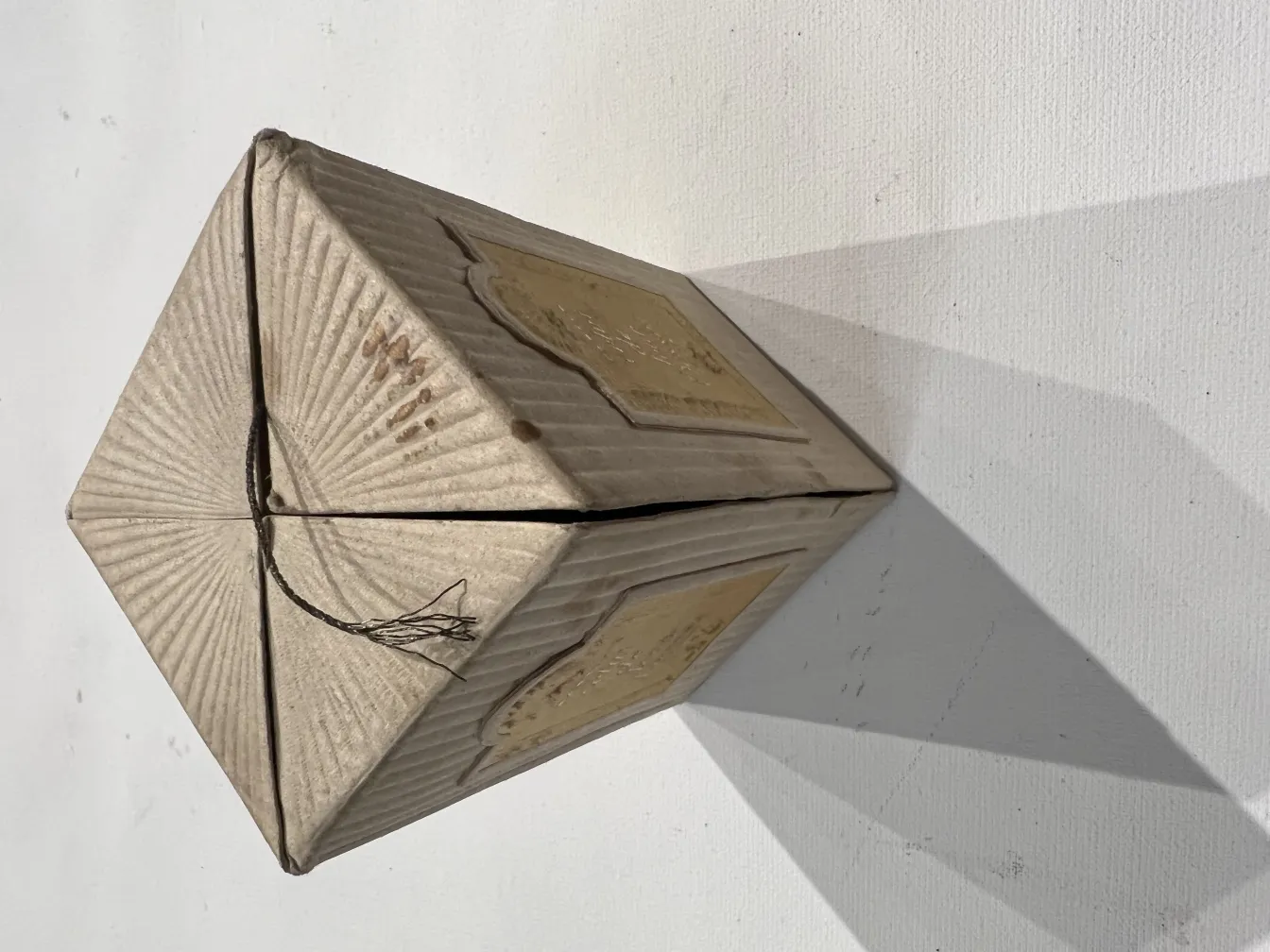 antique perfume bottle in a decorative box, with shadows