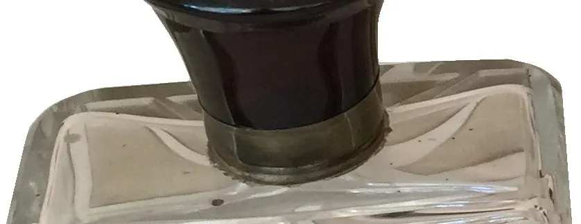 Antique perfume bottle with decorative cap