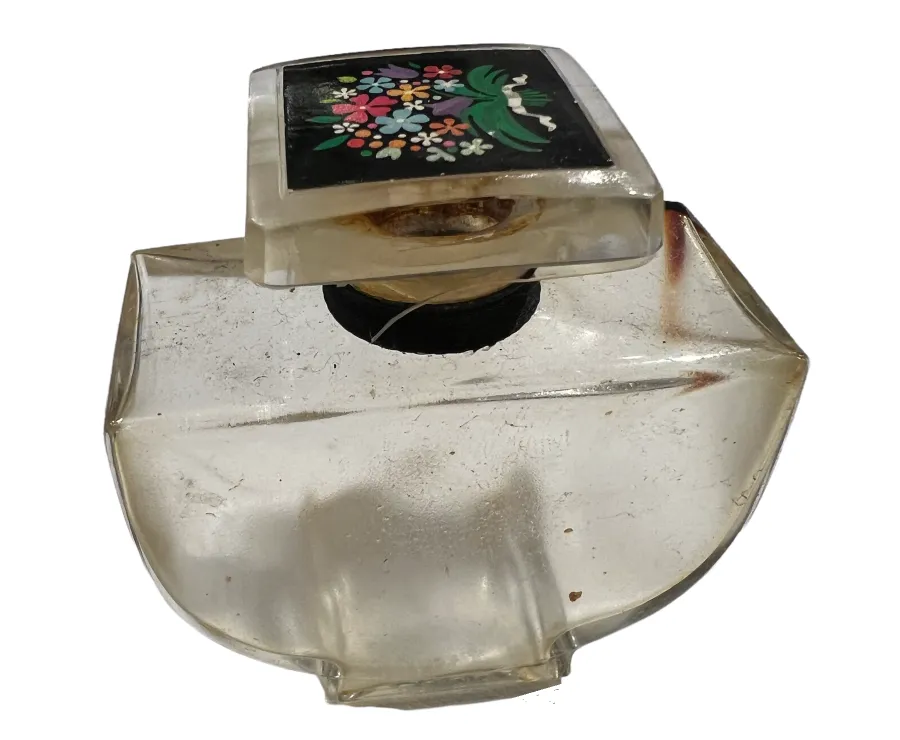 frasco de perfume antigo com tampa decorativa de flores