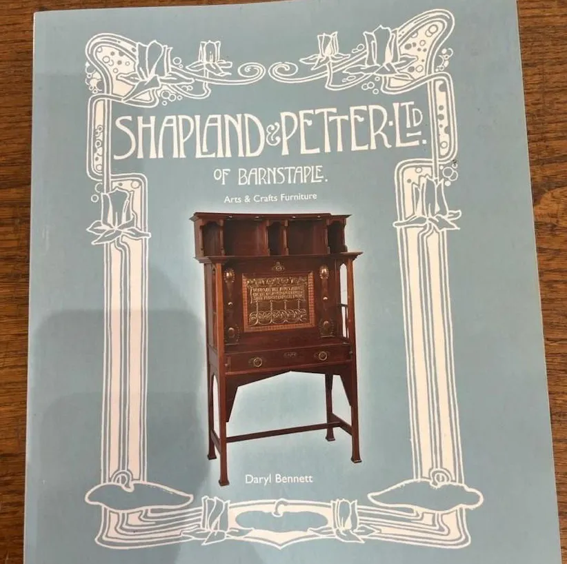 antique display cabinet by shapland-petter showcasing intricate designs