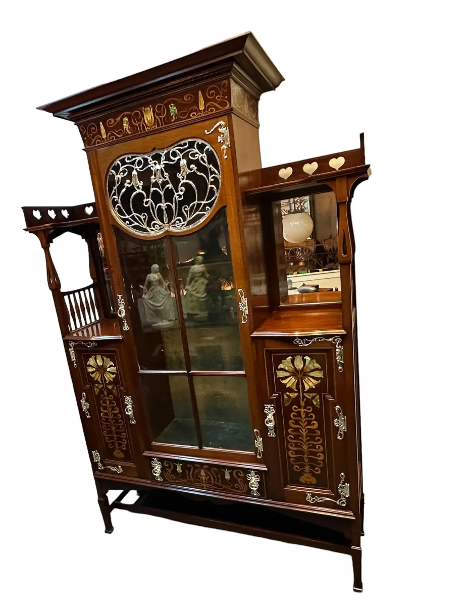 antique display cabinet with decorative details and glass
