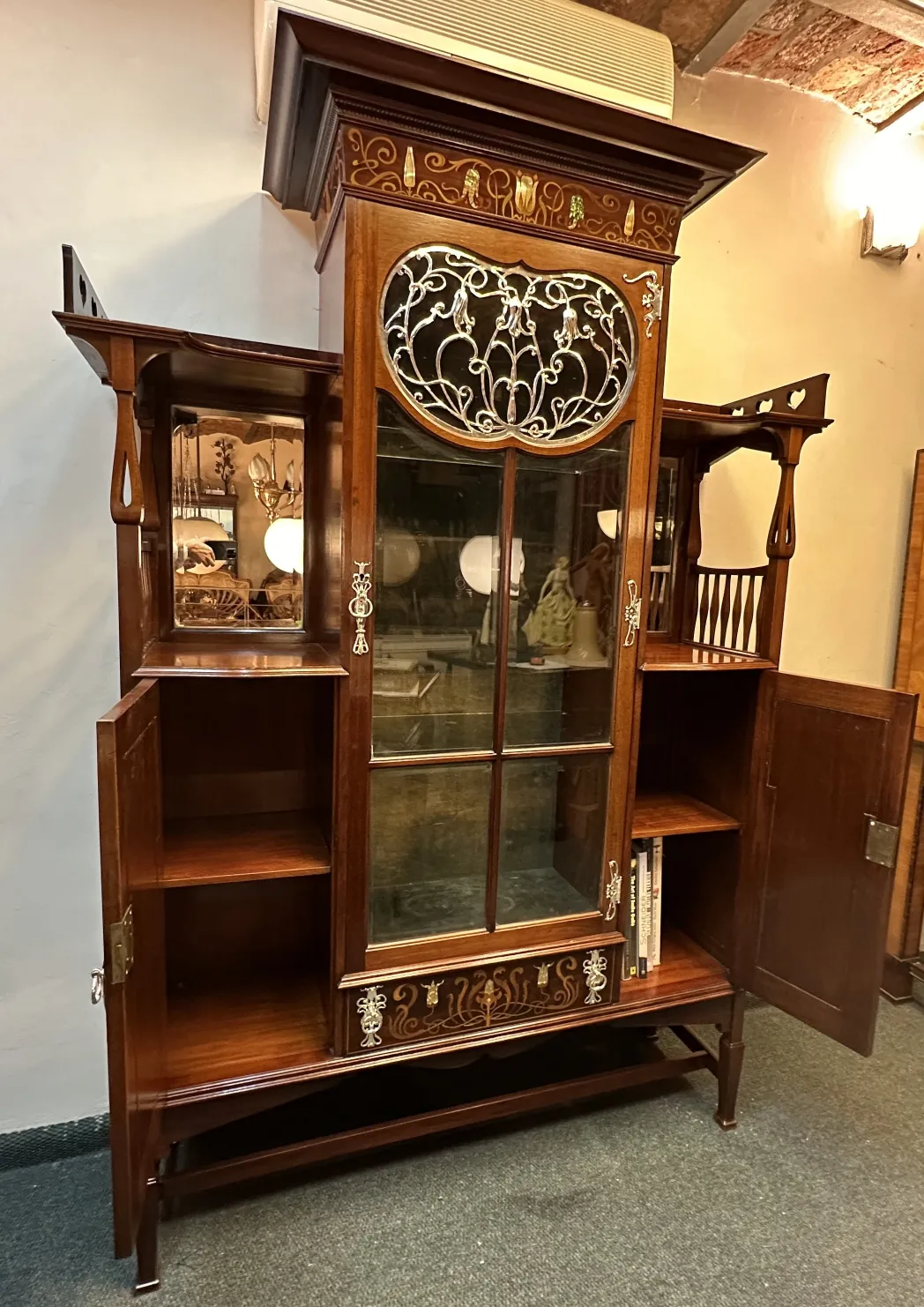 Antique display cabinet by Shapland & Petter with decorative details