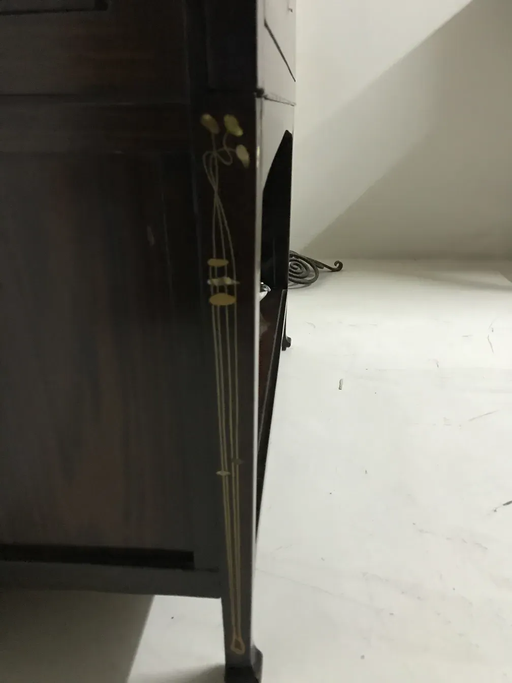 antique display cabinet with decorative details, elegant setting