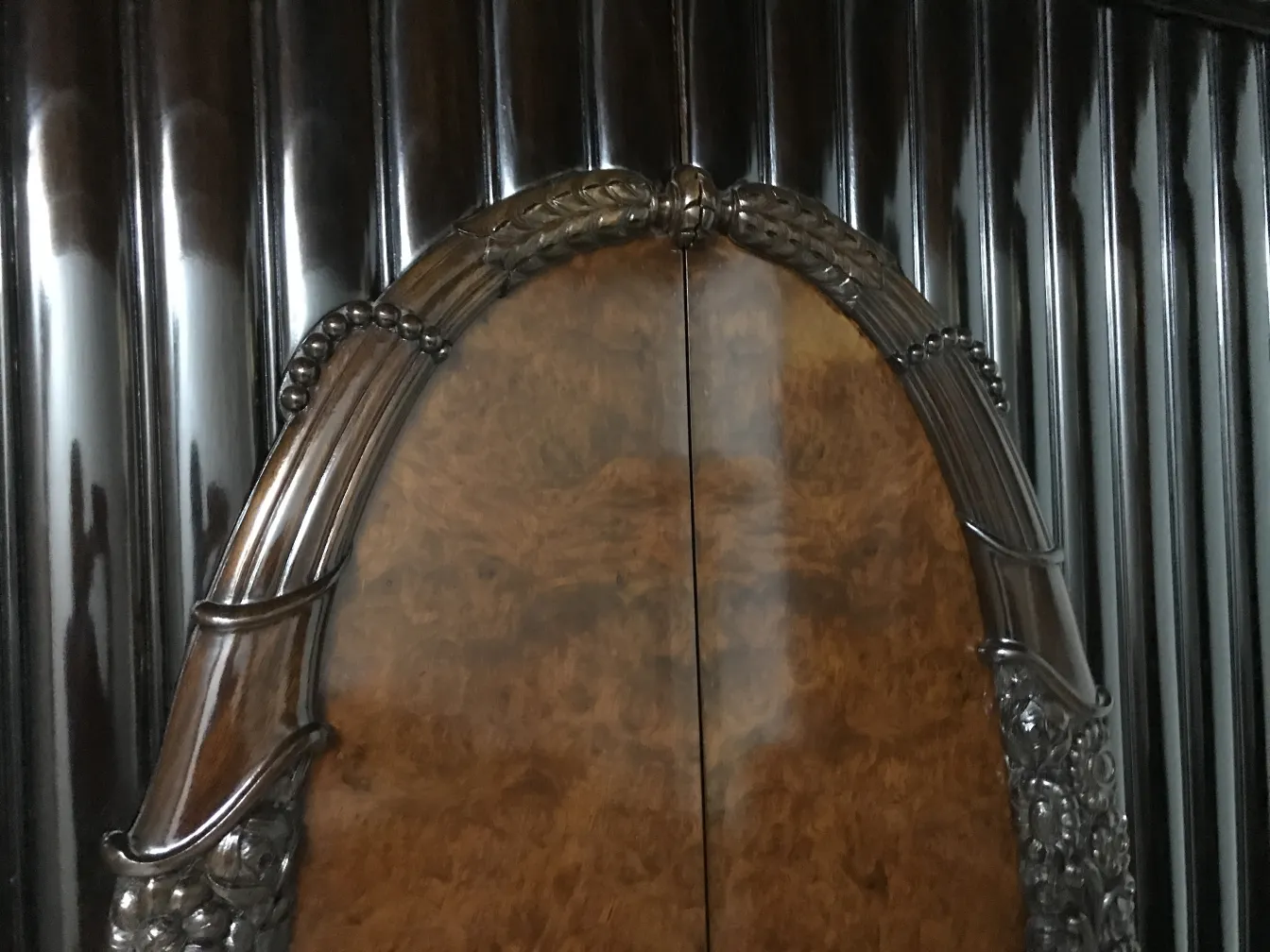 antique display cabinet with elegant design and ornamental details