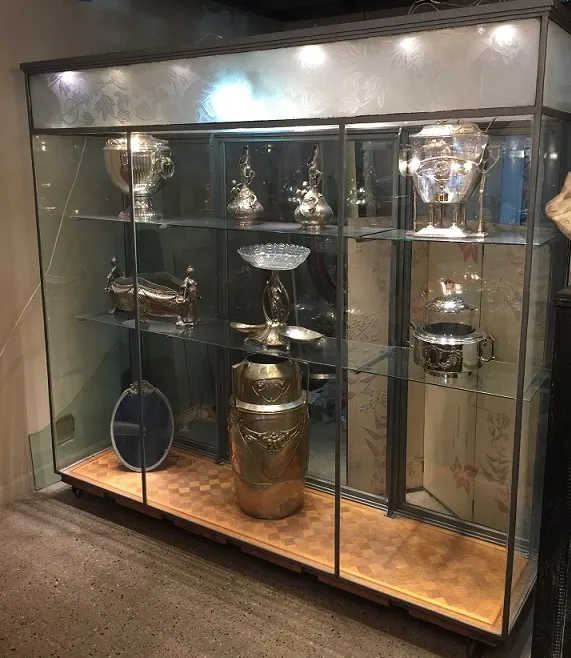 display cabinet showcasing antiques and decorative items