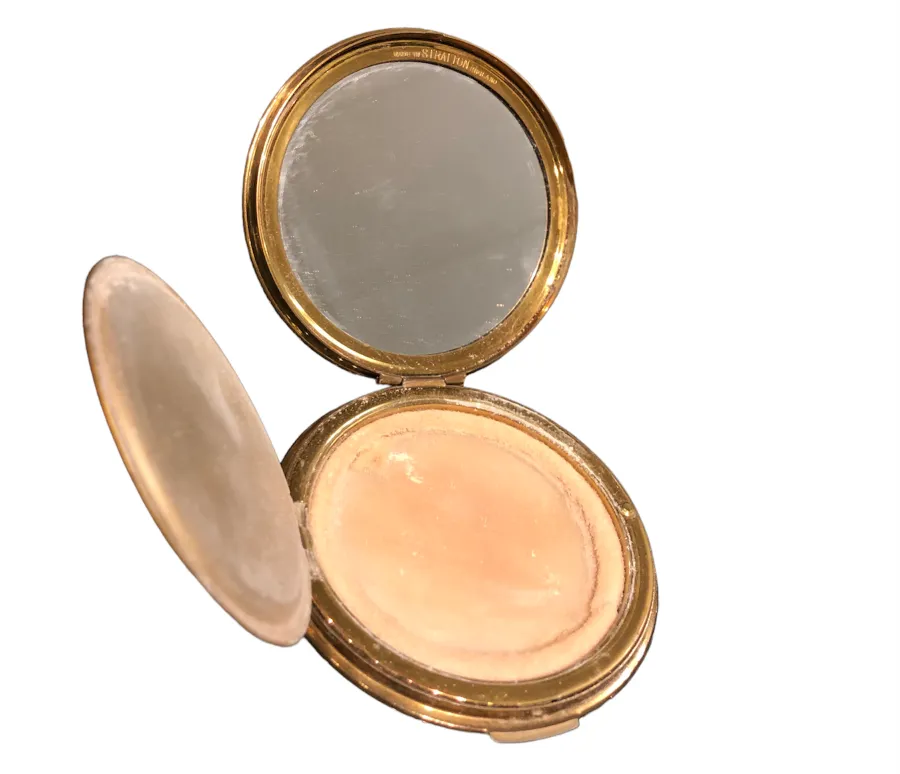 antique compact with a mirror inside, golden