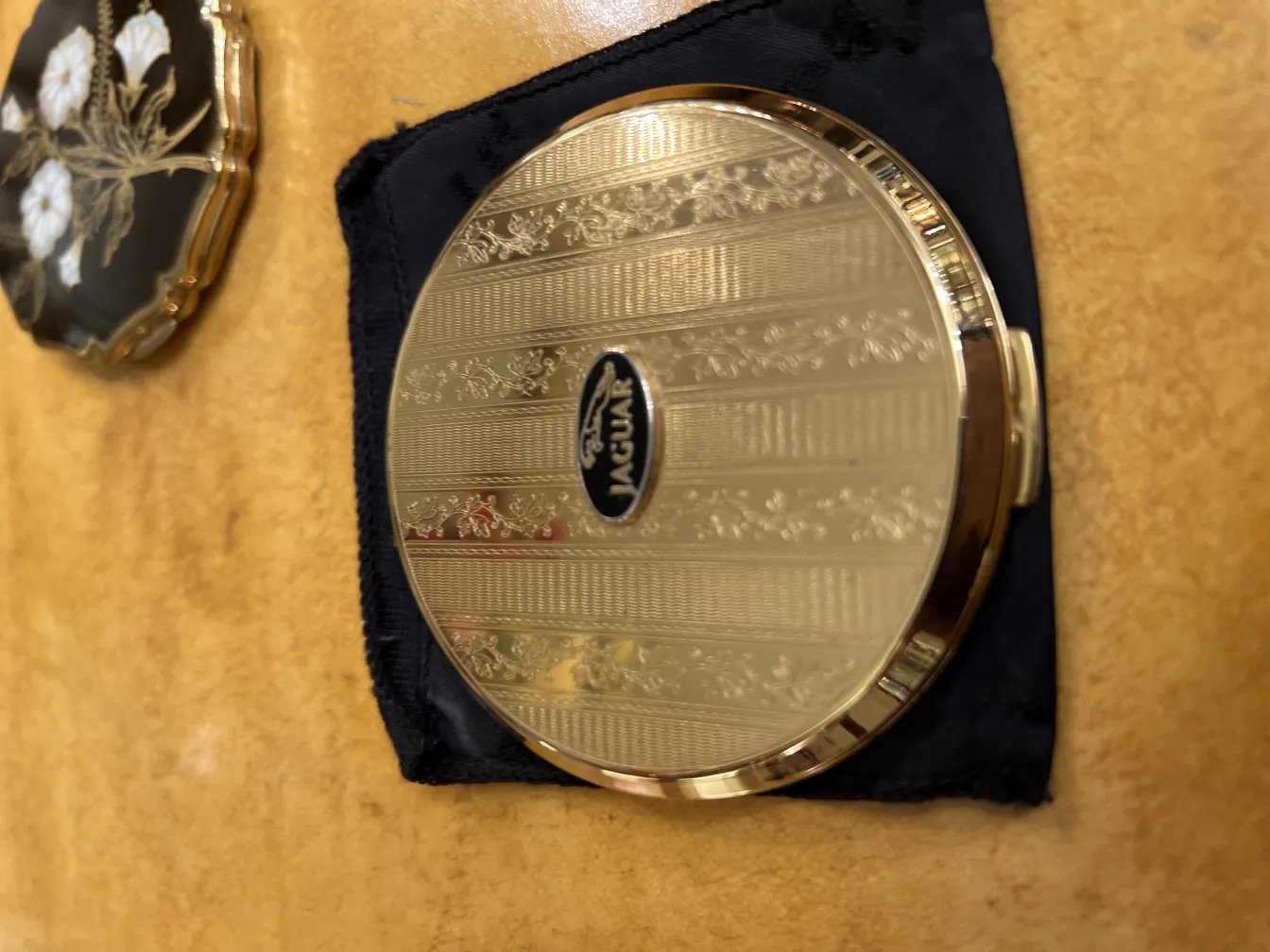 antique compact with decorative design, elegant details