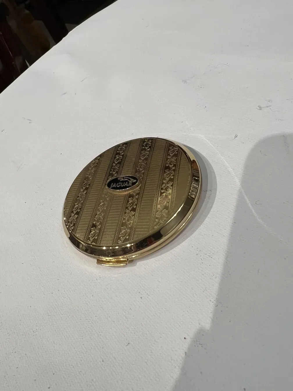 Antique compact Jaguar Stratton with gold design