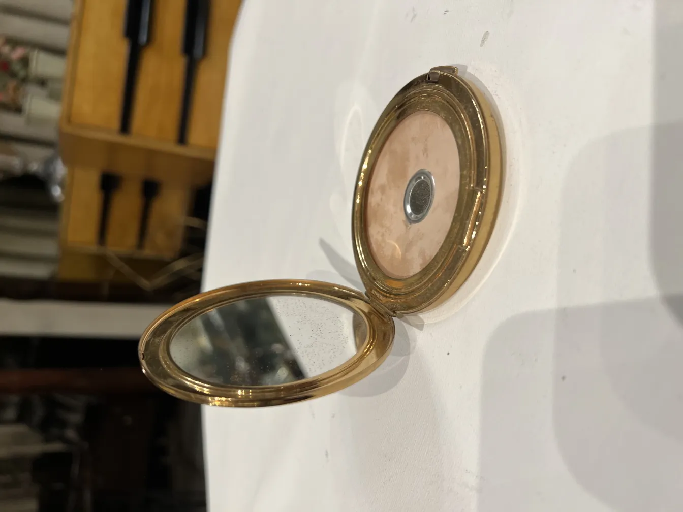 Antique compact with mirror, stylish and practical.