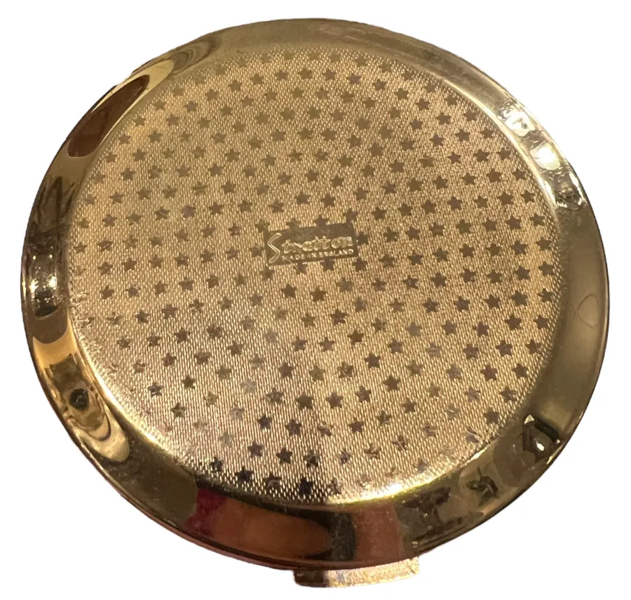 blush antigo stratton england com superfície dourada e design de estrelas